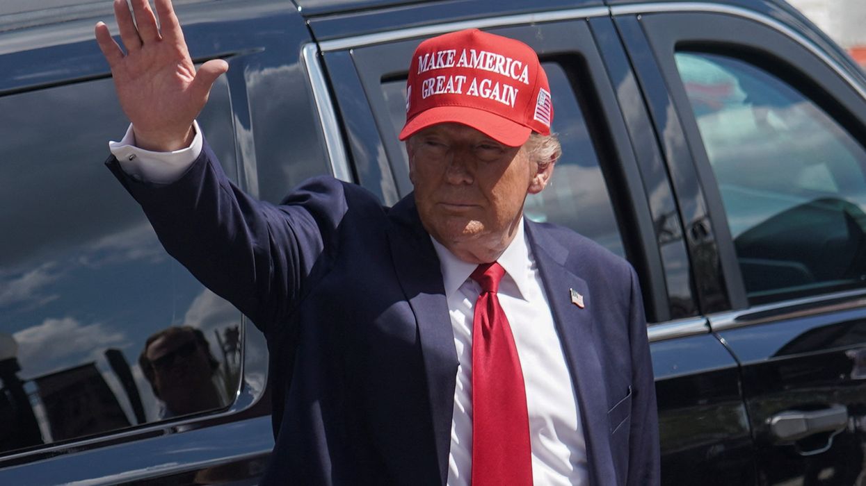 Republican presidential nominee and former US President Donald Trump gestures as he attends an event about the damage caused by Hurricane Helene, in Valdosta, Georgia