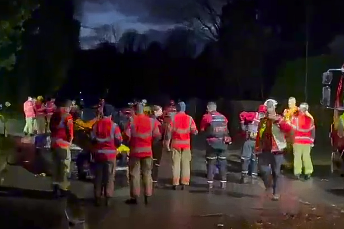 'Asylum hotel' evacuated as boats dispatched to rescue migrants stranded in severe flooding