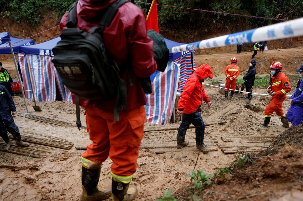 Rescue workers work at the site