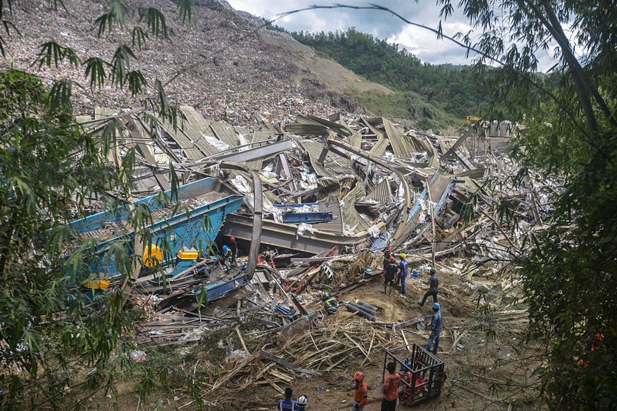 Rescuers continue search operations after a landslide at a landfill in Barangay Binaliw,