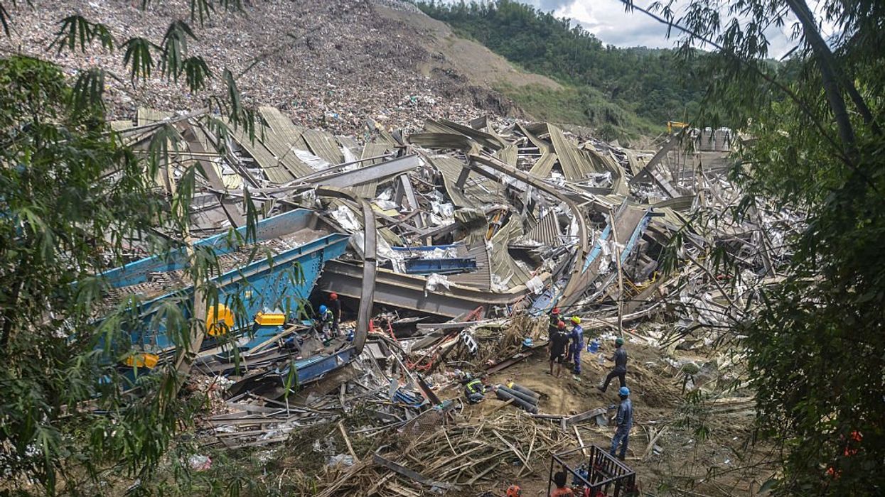 Rescuers continue search operations after a landslide at a landfill in Barangay Binaliw,