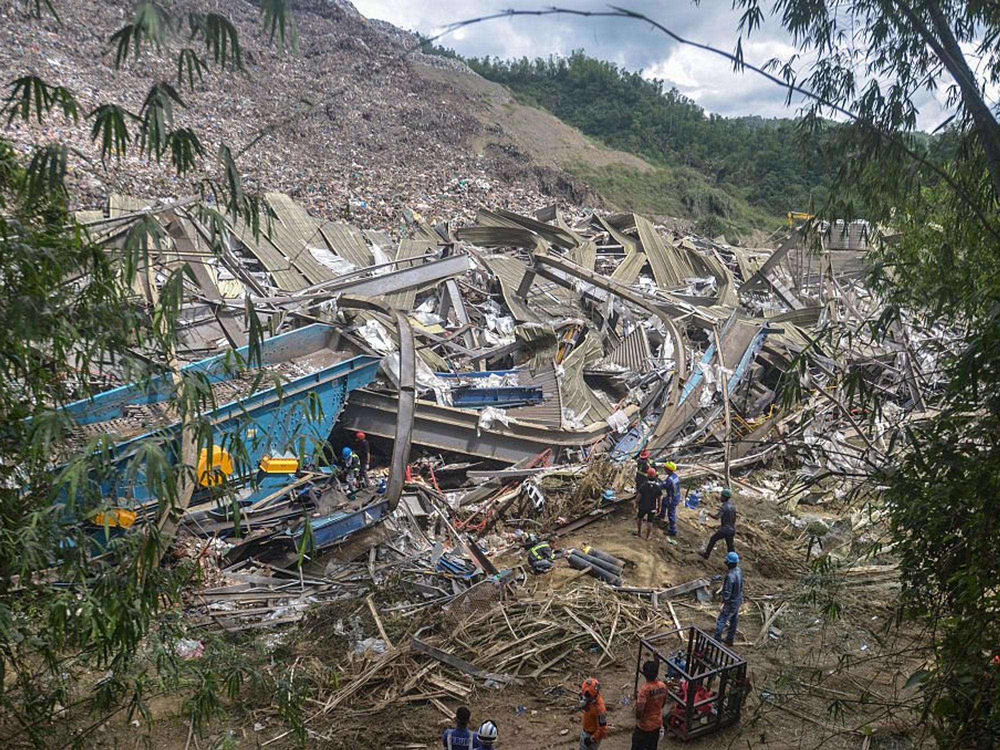 Rescuers continue search operations after a landslide at a landfill in Barangay Binaliw,