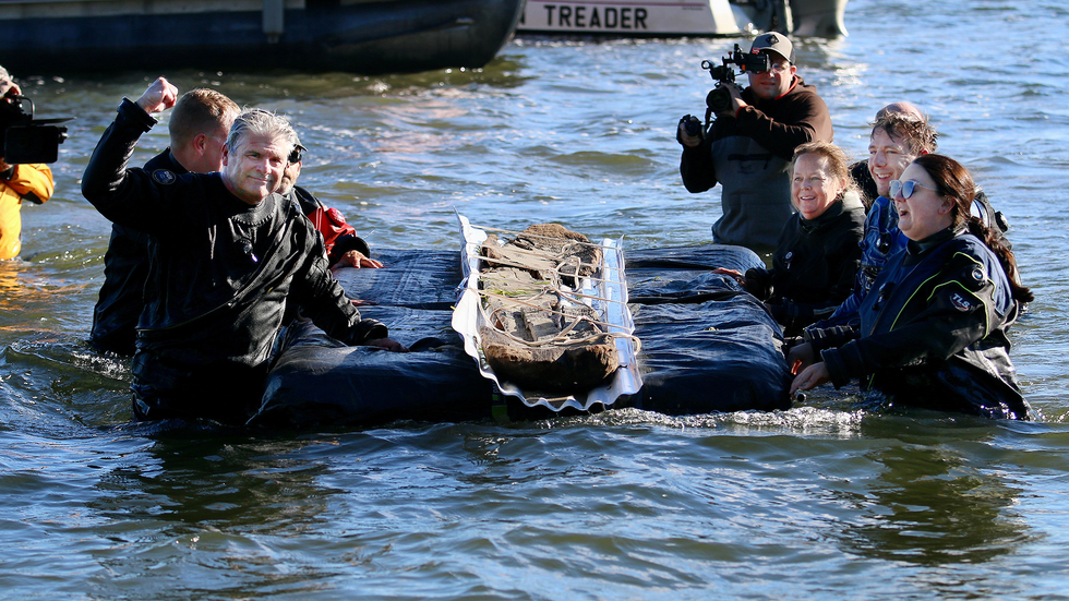 Researchers remove canoes from water
