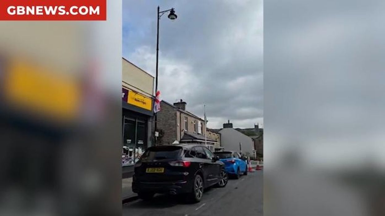 Watch as residents proudly fly St George's flags across town: 'This is about patriotism!'