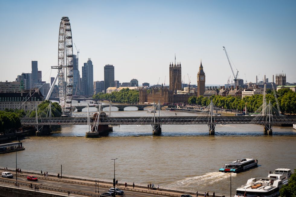 RETRANSMITTED CORRECTING DATE TAKEN A view of The London Eye, the Elizabeth Tower, Houses of Parliament and the Thames river, London on a sunny day. Picture date: Sunday August 7, 2022.