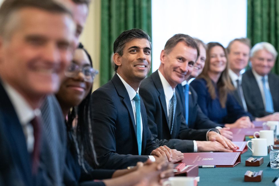 RETRANSMITTING CORRECTING POSITION OF HUNT Prime Minister Rishi Sunak (centre), alongside the Chancellor of the Exchequer, Jeremy Hunt (centre right), holds his first Cabinet meeting in Downing street. Picture date: Wednesday October 26, 2022.