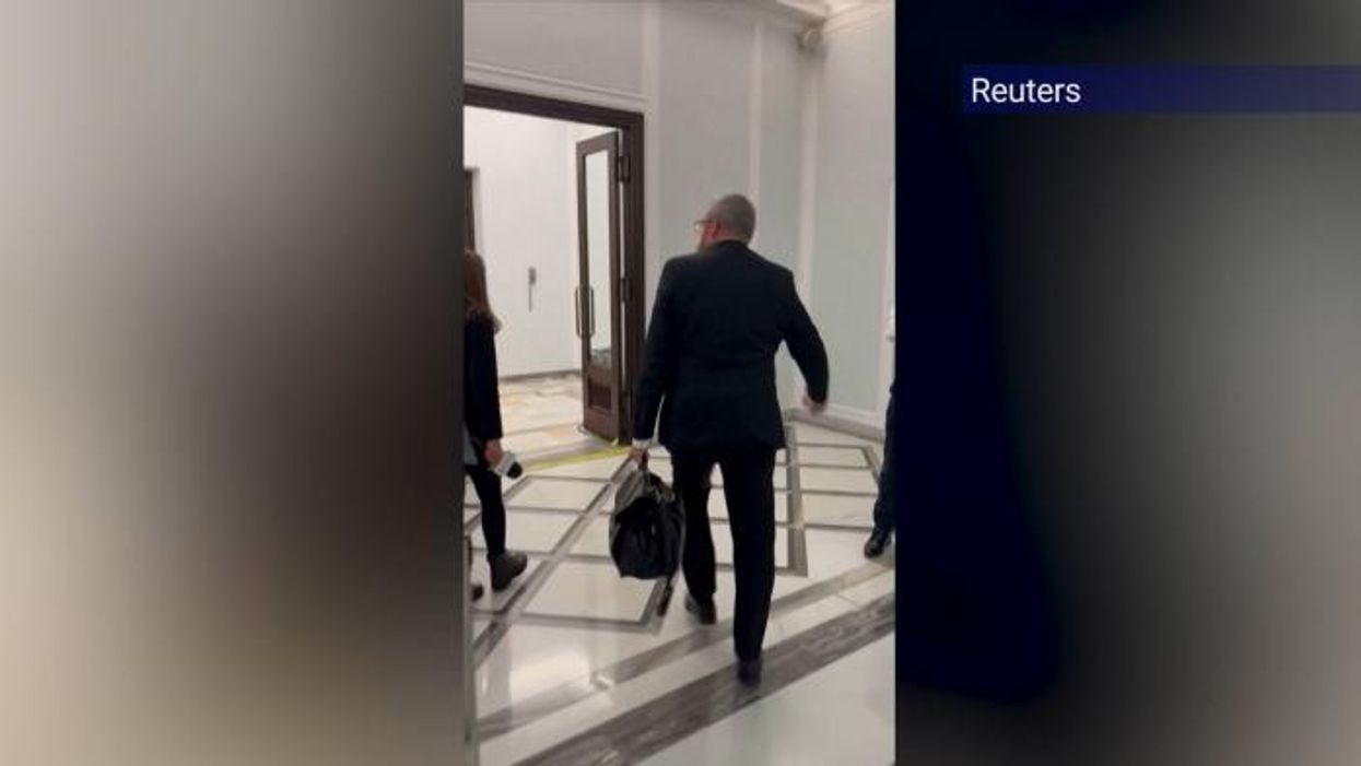 Far-right Polish MP sparks outrage after using fire extinguisher on Hanukkah candles