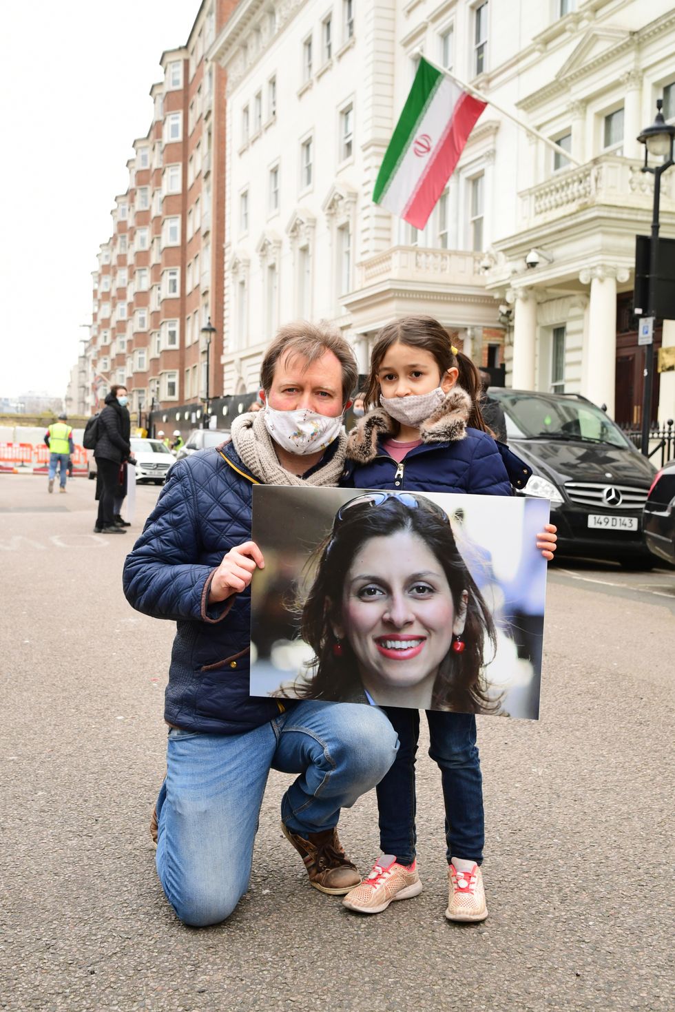 Richard Ratcliffe, the husband of Nazanin Zaghari-Ratcliffe, with his daughter Gabriella during a protest outside the Iranian Embassy in London in March 2021