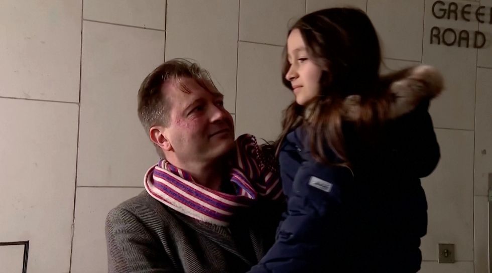 Richard Ratcliffe with their daughter after hearing the news that Nazanin was on her way home.