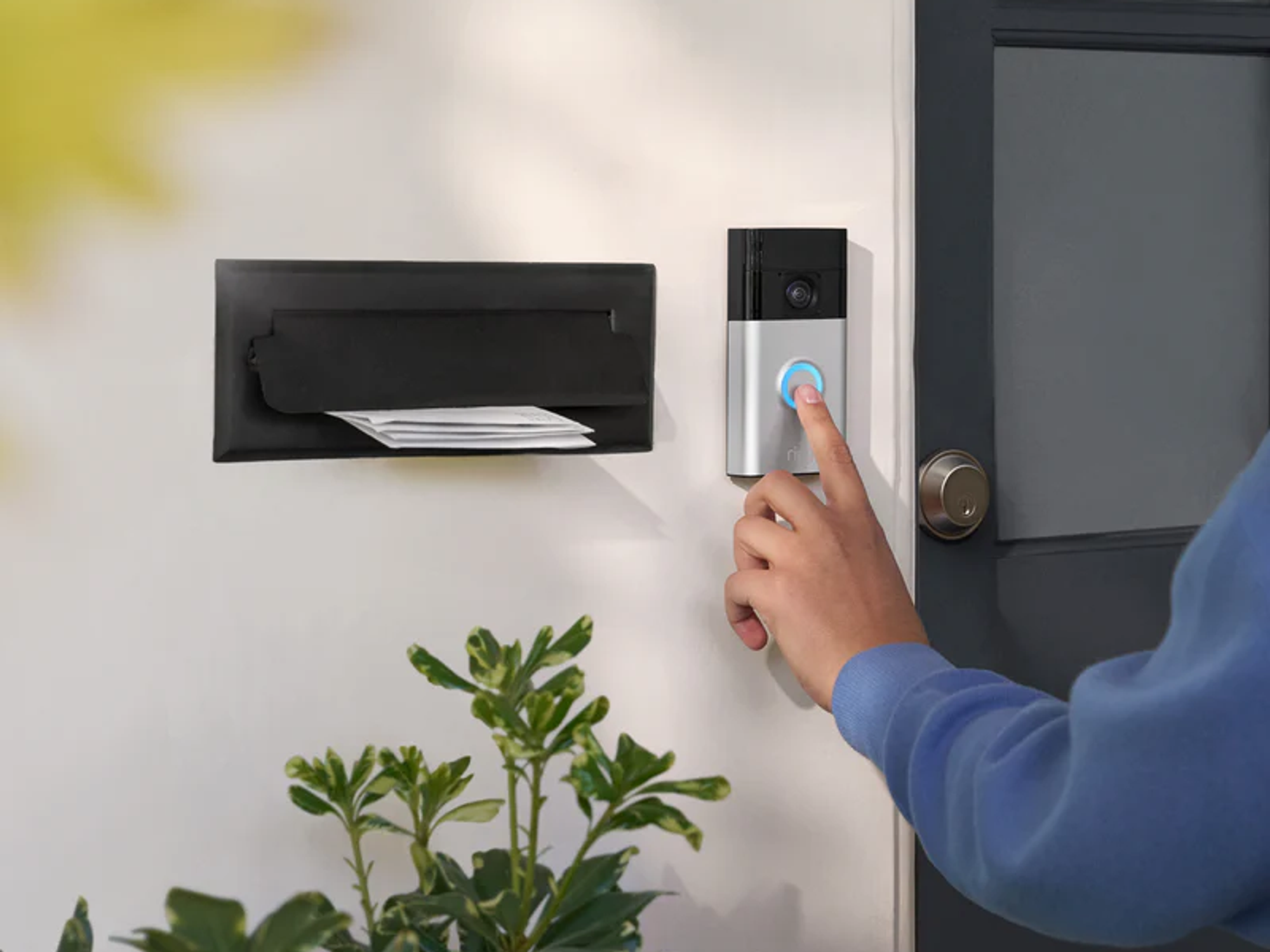 Ring video doorbell mounted next to front door