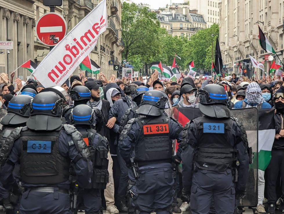 Riot police and pro-Palestine protesters in Paris