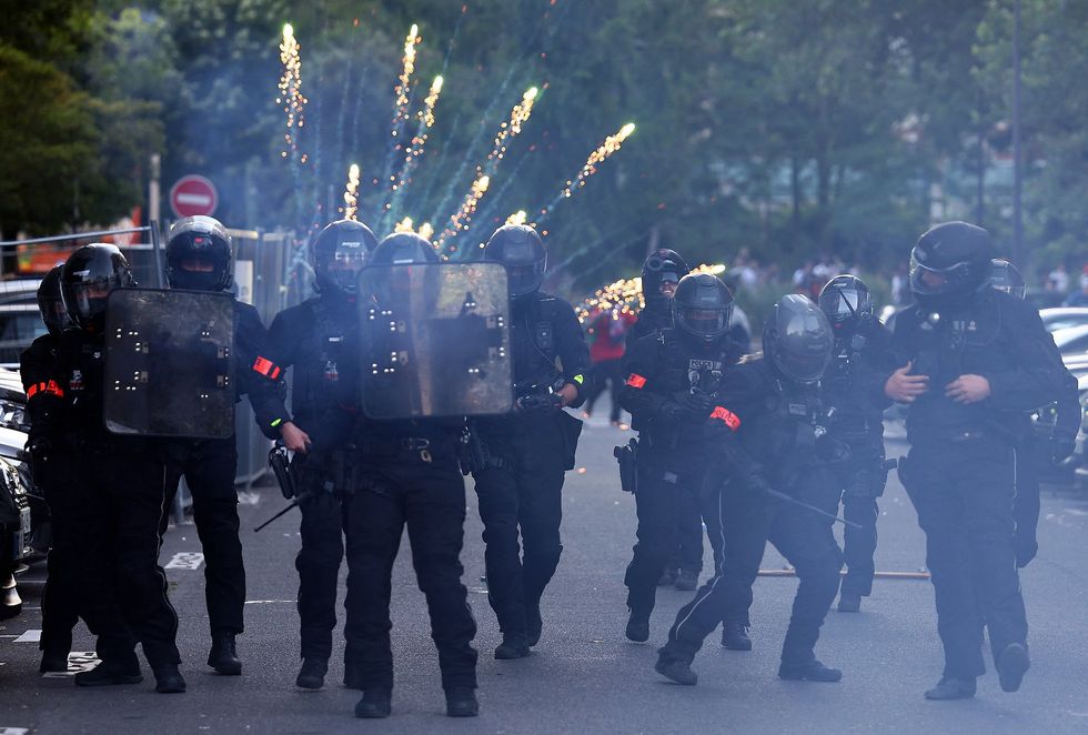 Riot police clashed with crowds in Paris moments after PSG beat Arsenal