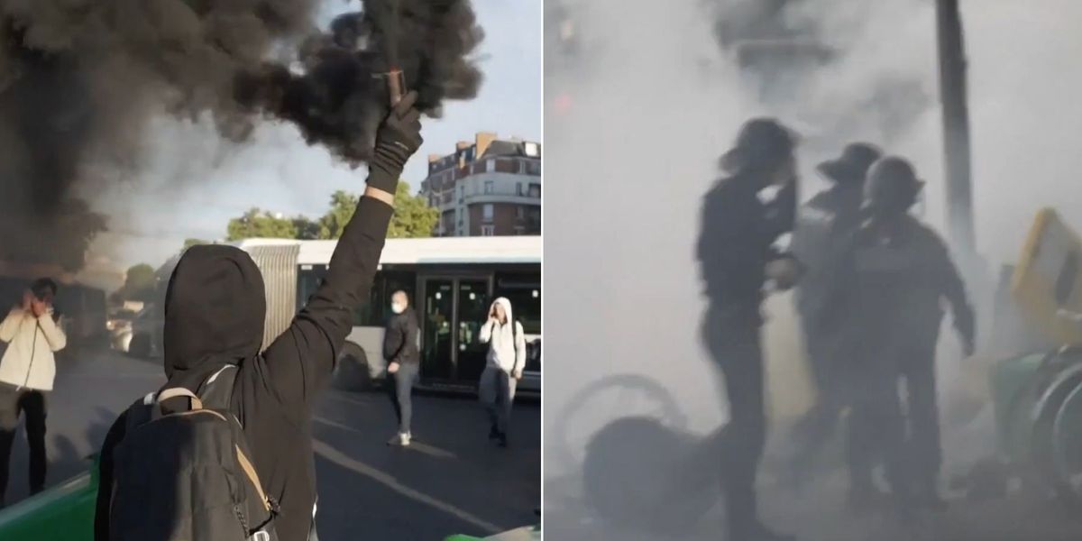 NextImg:Shocking video shows moment chaos erupts as riot police hurl tear gas at protesters in street battle
