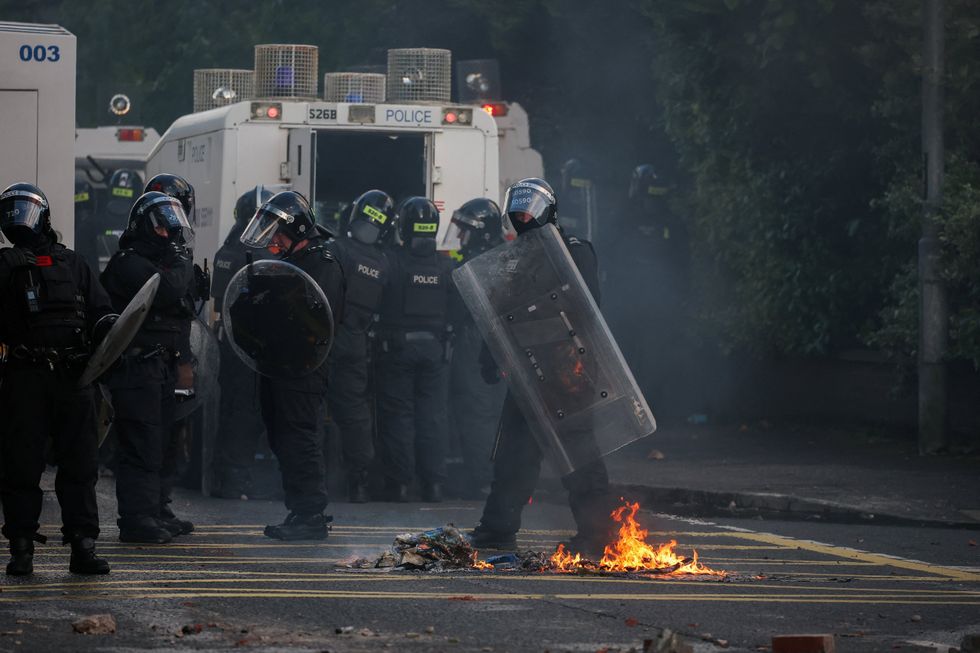 Riot police in Northern Ireland after Belfast knife attack