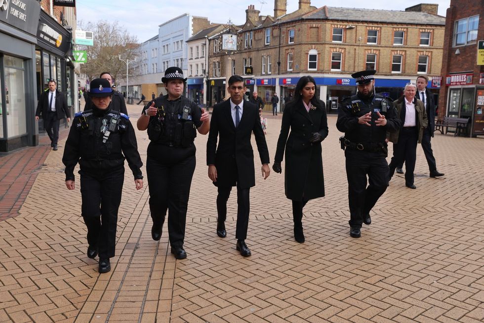 Rishi Sunak and Suella Braverman with PCSOs and police officers in Essex