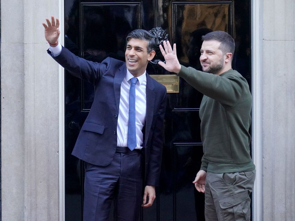 Rishi Sunak and Volodymyr Zelensky waving to the crowd
