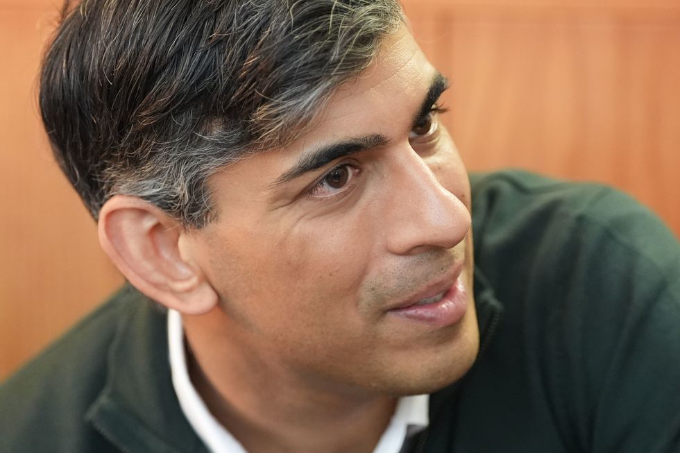 Rishi Sunak attends a neighbourhood watch meeting at the Dog & Bacon pub in Horsham