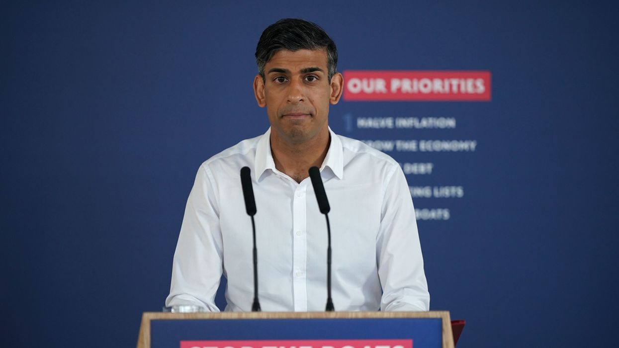 Rishi Sunak speaking to reporters