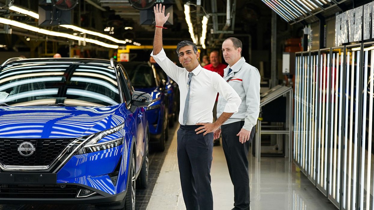 Rishi Sunak with a Nissan EV