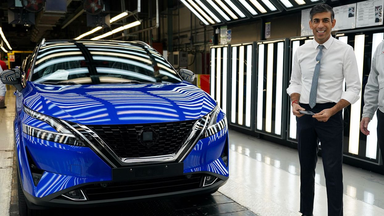 Rishi Sunak with an electric Nissan