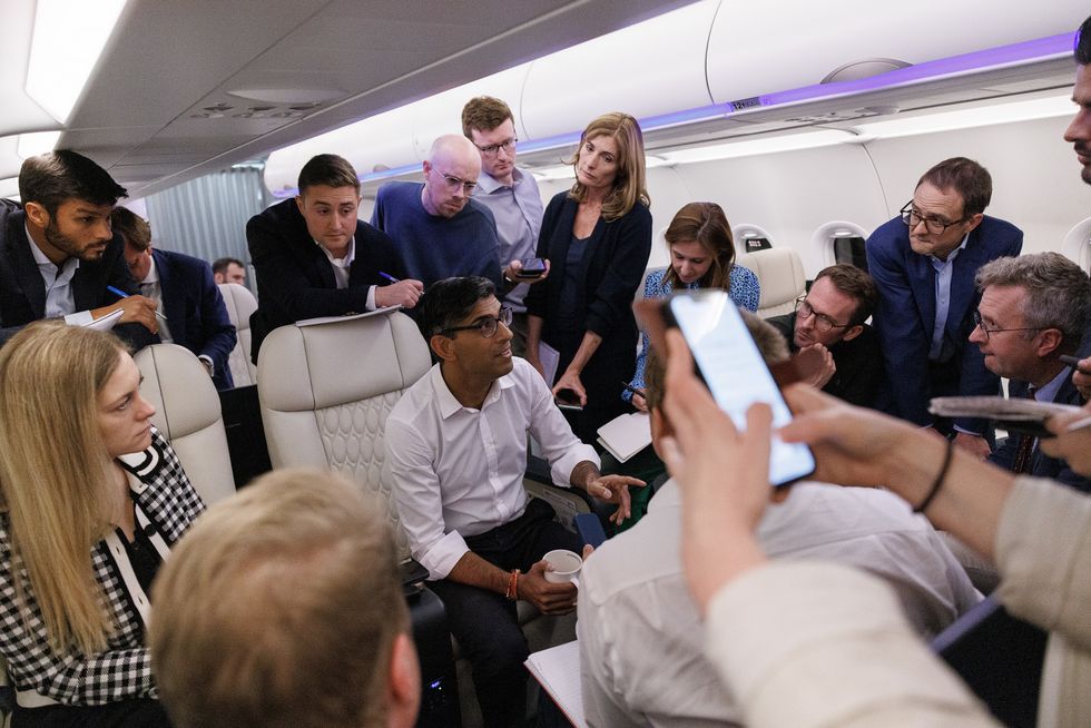 Rishi Sunak with reporters