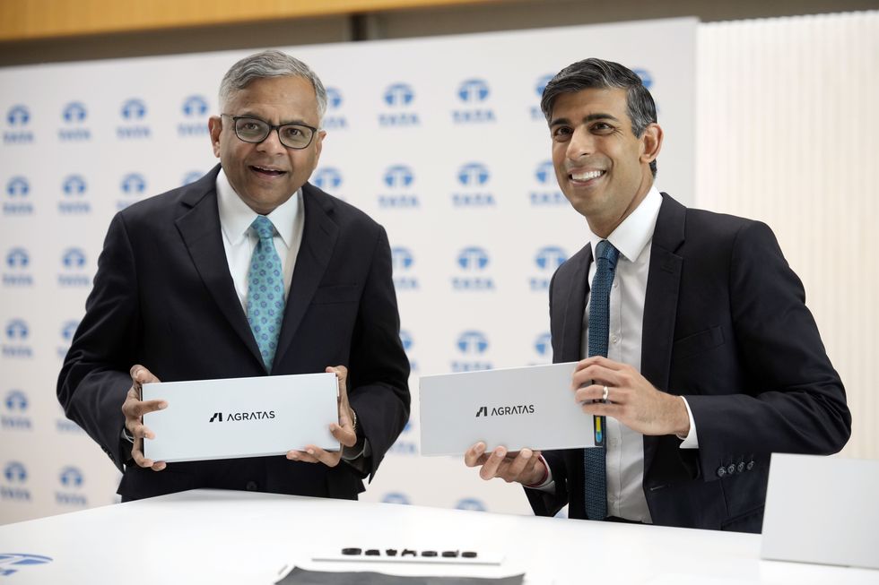 Rishi Sunak with Tata Chairman Natarajan Chandrasekaran view a battery cell during his visit to JLR