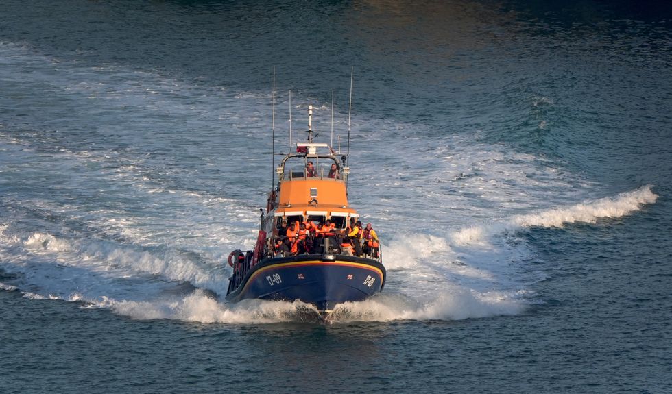 RNLI vessel escorting migrants to Dover