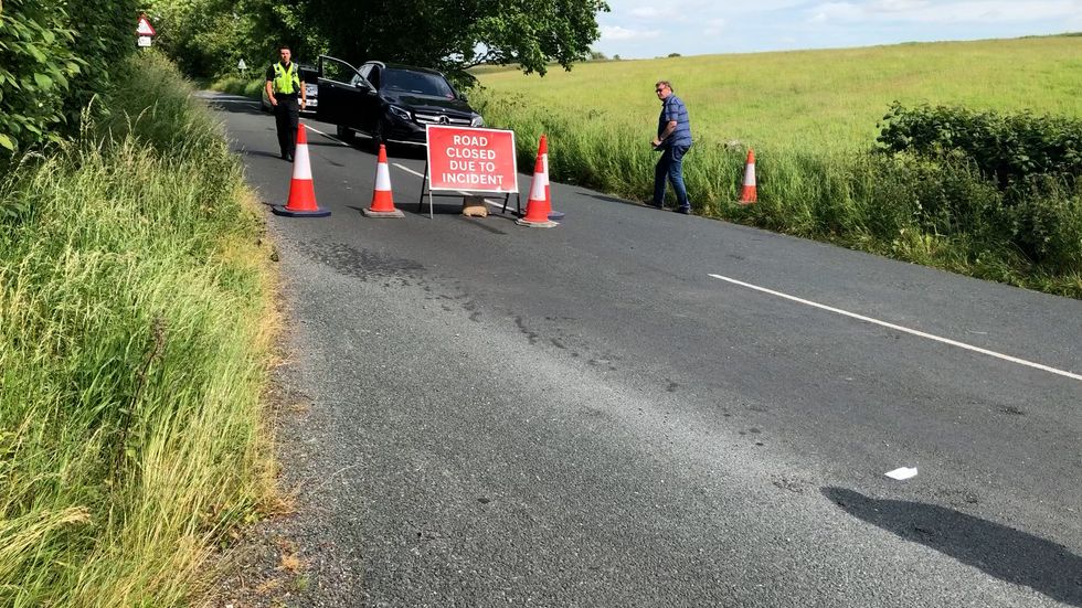 Road closed by police near to the scene of an helicopter crash in a field near Burton in Lonsdale, North Yorkshire, where two people died. Picture date: Monday June 20, 2022.