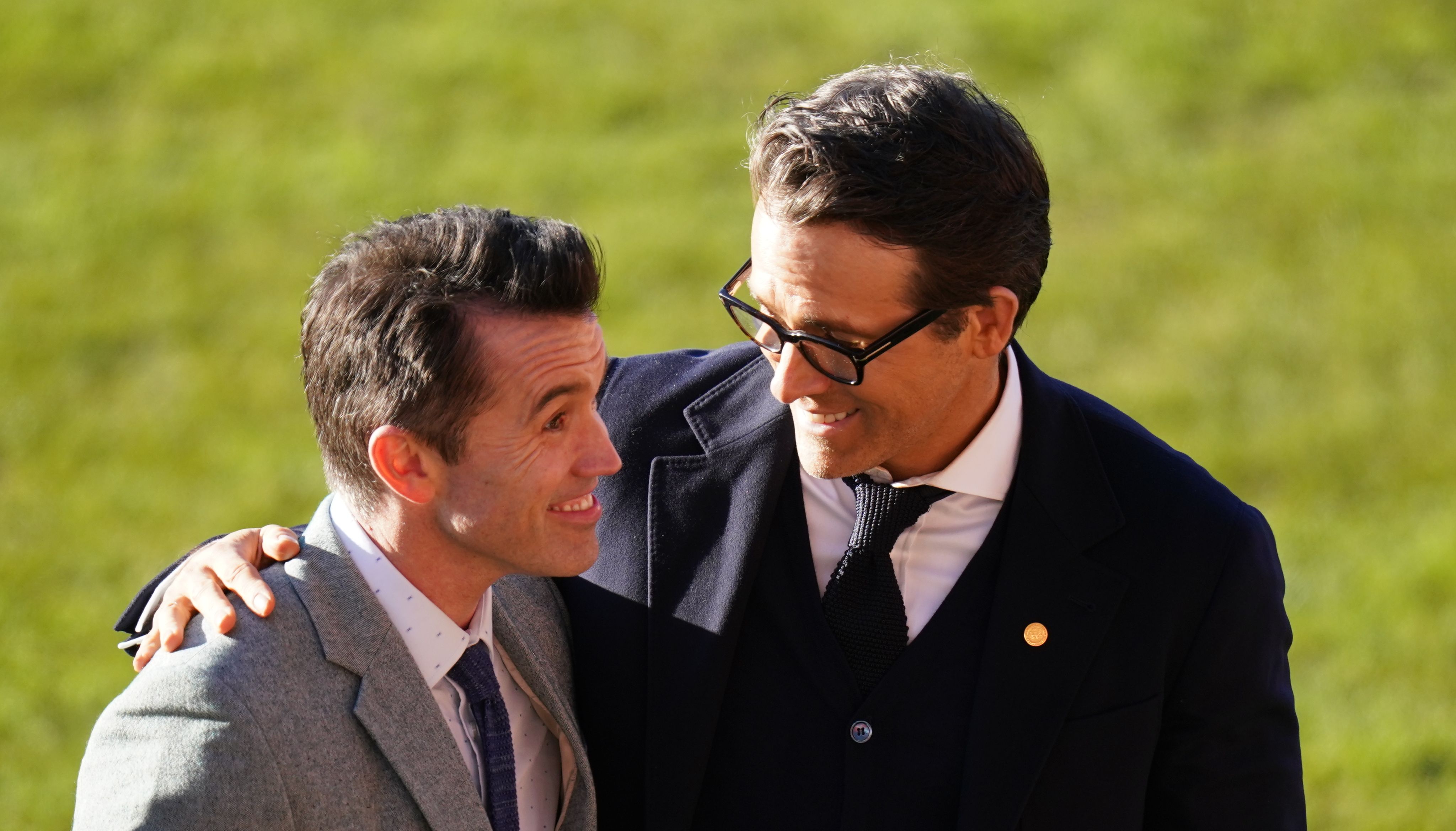 Rob McElhenney (left) and Ryan Reynolds ahead of the visit of King Charles III and the Queen Consort to Wrexham Association Football Club's Racecourse Ground. Picture date: Friday December 9, 2022.