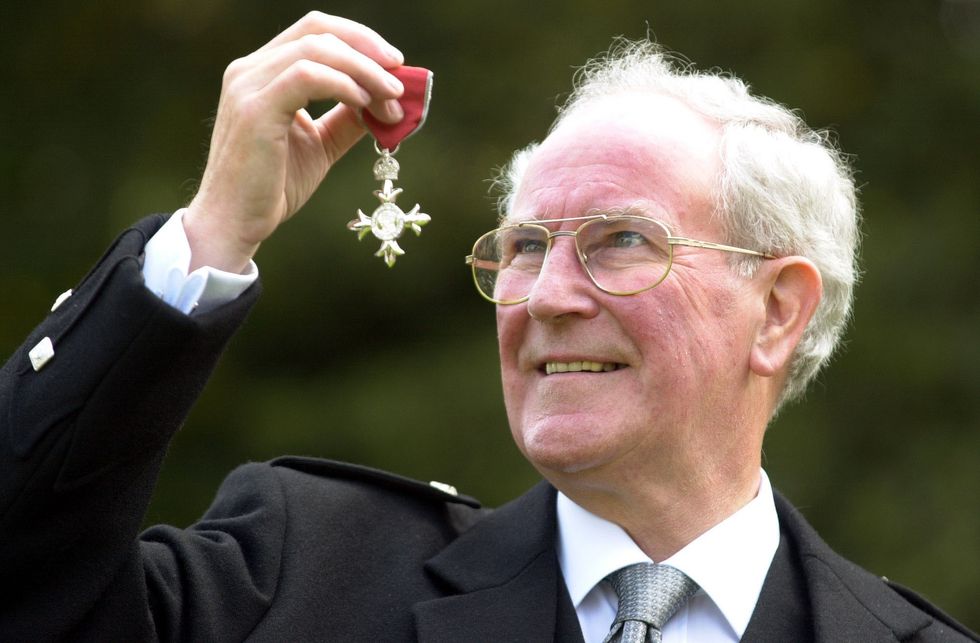 Robert 'Robbie' Shepherd, displays the Member of the Most Excellent Order of the British Empire award