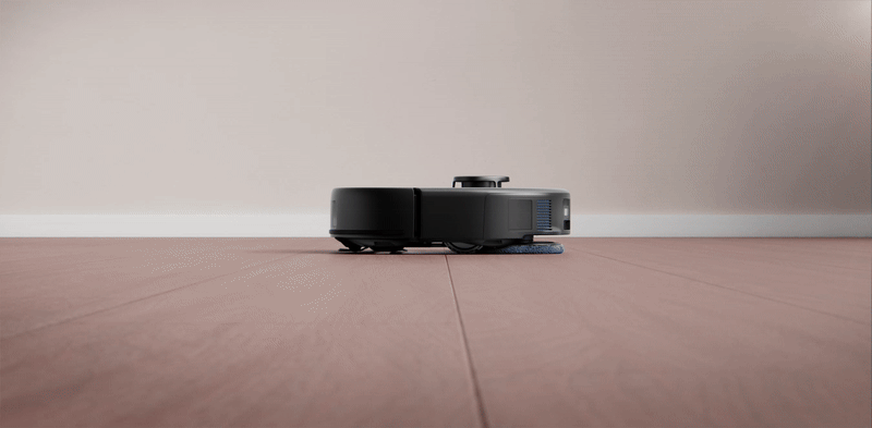 Robot vacuum cleaner zooming across hardwood and carpet
