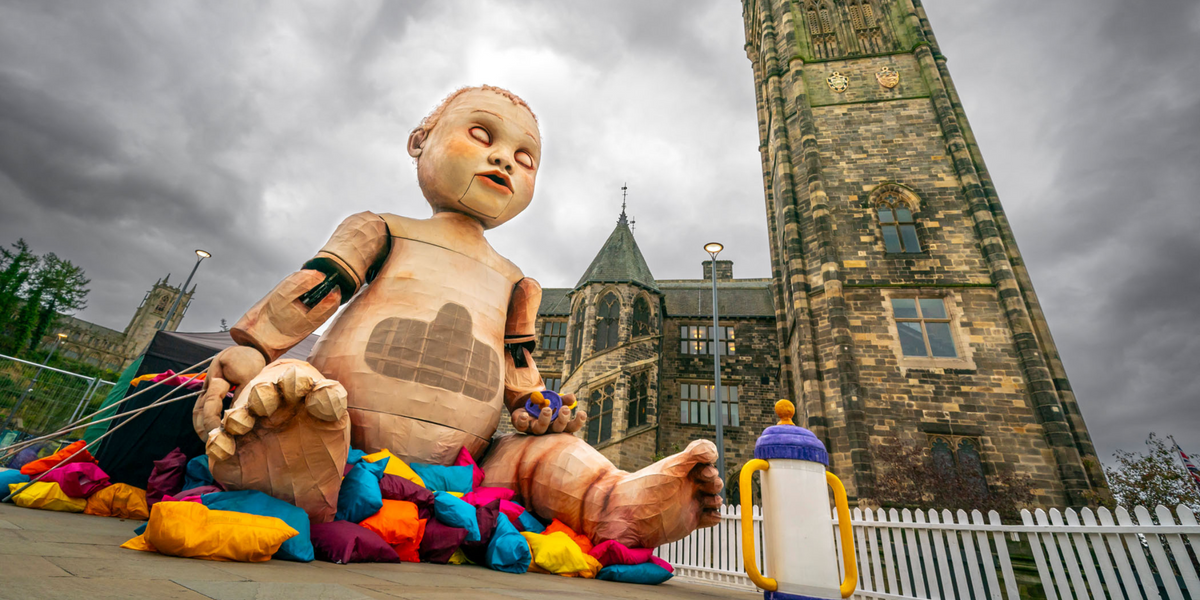 NextImg:Locals left terrified as 'creepy' giant baby installed in town centre
