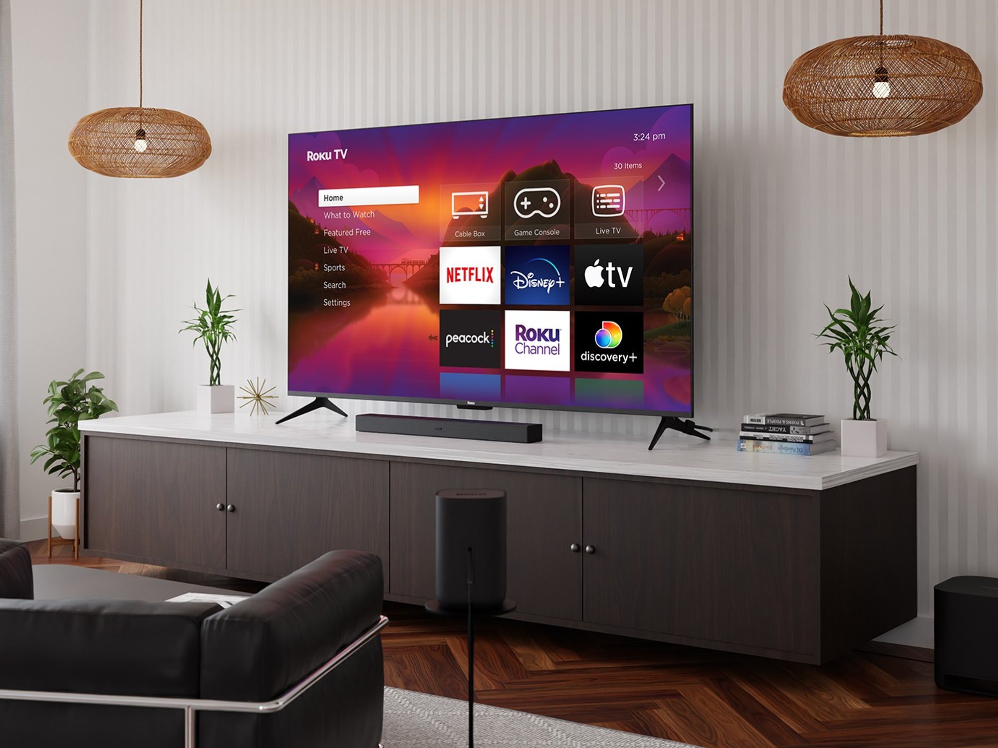roku tv pictured mounted on the wall of a living room with a selection of streaming services pictured on-screen
