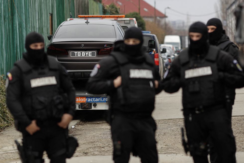 Romanian officials transport the cars seized from the Tate compund to an undisclosed storage location, from Voluntari, Ilfov, Romania, January 14, 2023. Inquam Photos/Octav Ganea via REUTERS ATTENTION EDITORS - THIS IMAGE WAS PROVIDED BY A THIRD PARTY. ROMANIA OUT. NO COMMERCIAL OR EDITORIAL SALES IN ROMANIA