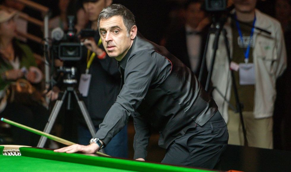 Ronnie O'Sullivan was seen remaining in his chair after Judd Trump's achievement