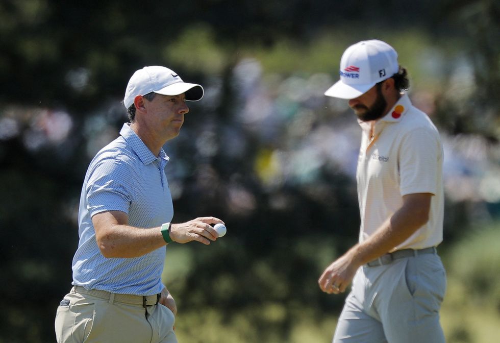 Rory McIlroy and Cam Young are battling it out for the Green Jacket