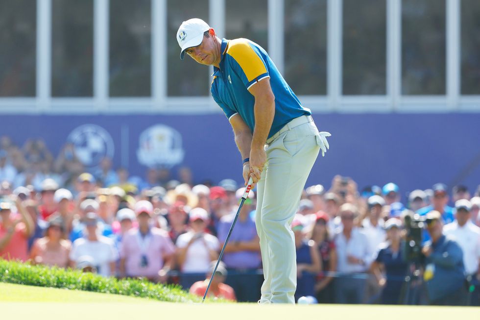 Rory McIlroy of Team Europe putts on the sixth green