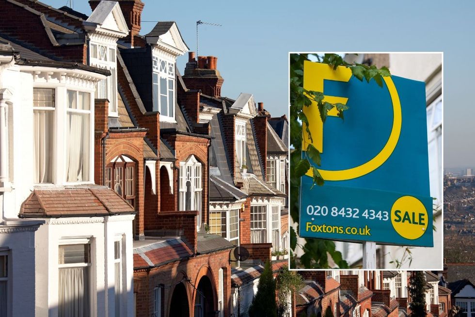 ROW OF HOUSES AND SALE SIGN