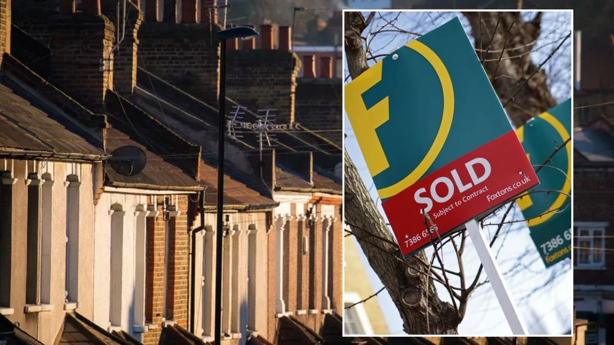 ROW OF HOUSES AND SALE SIGN