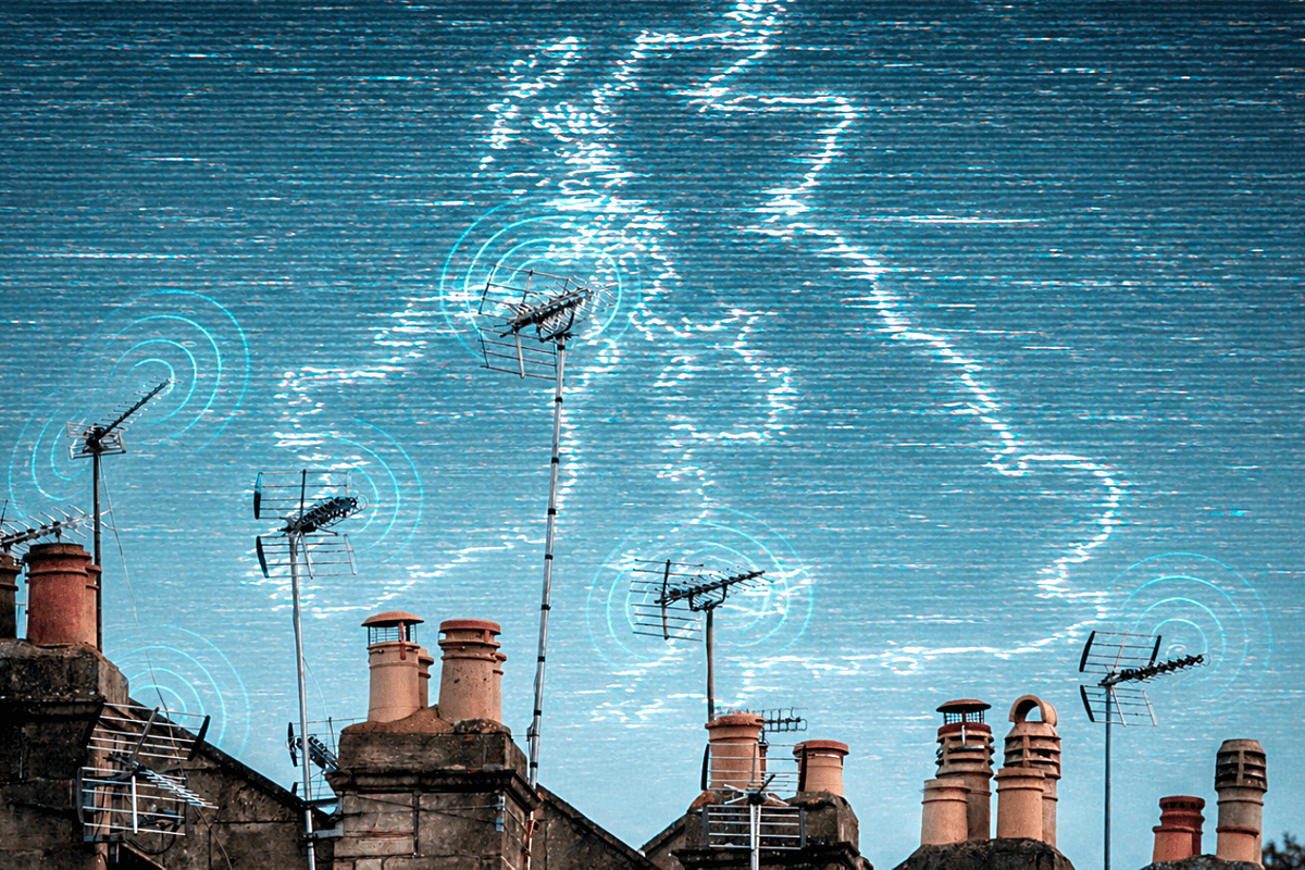 row of terrace houses in the UK with television aerials shown