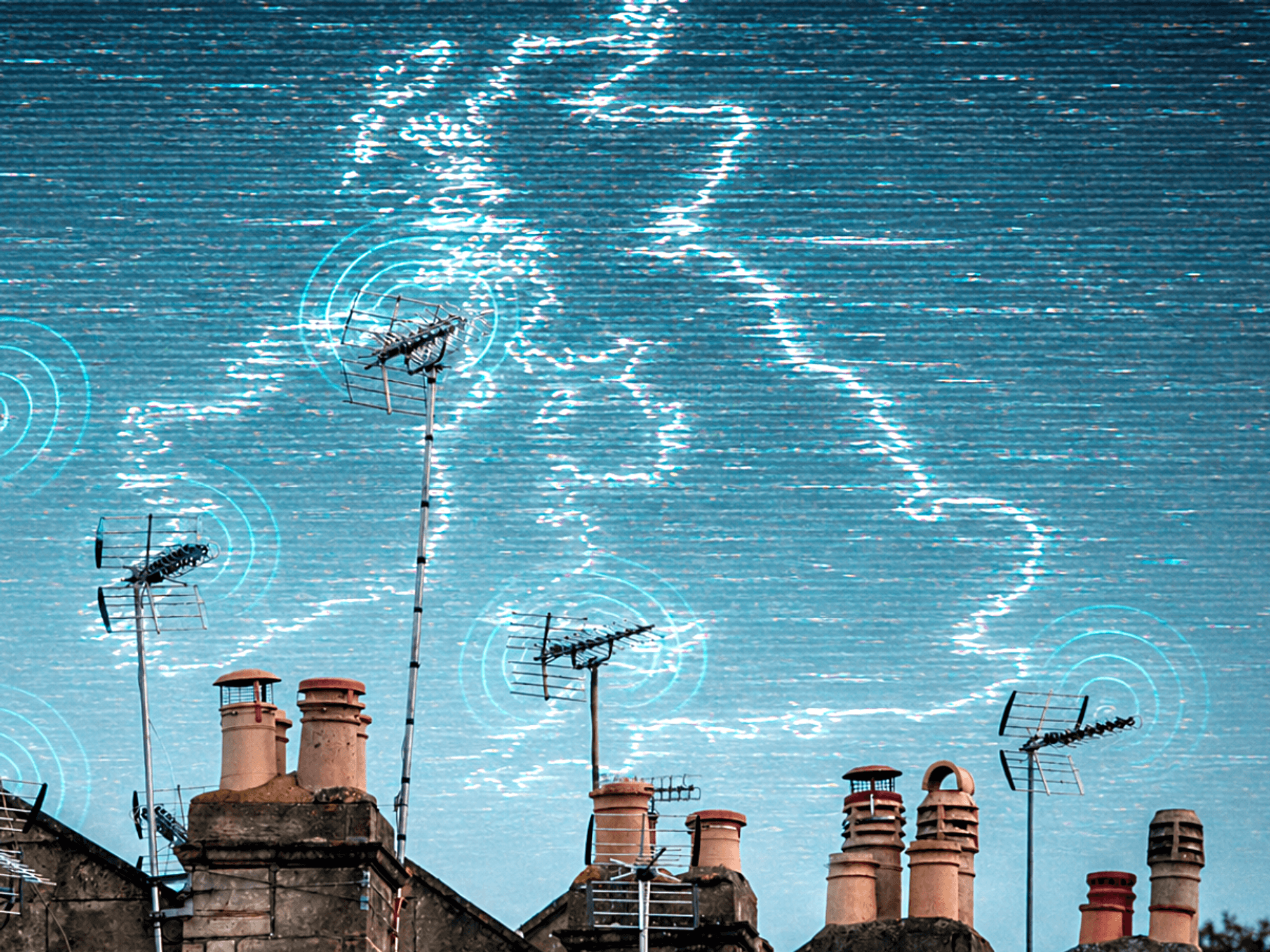 row of terrace houses in the UK with television aerials shown