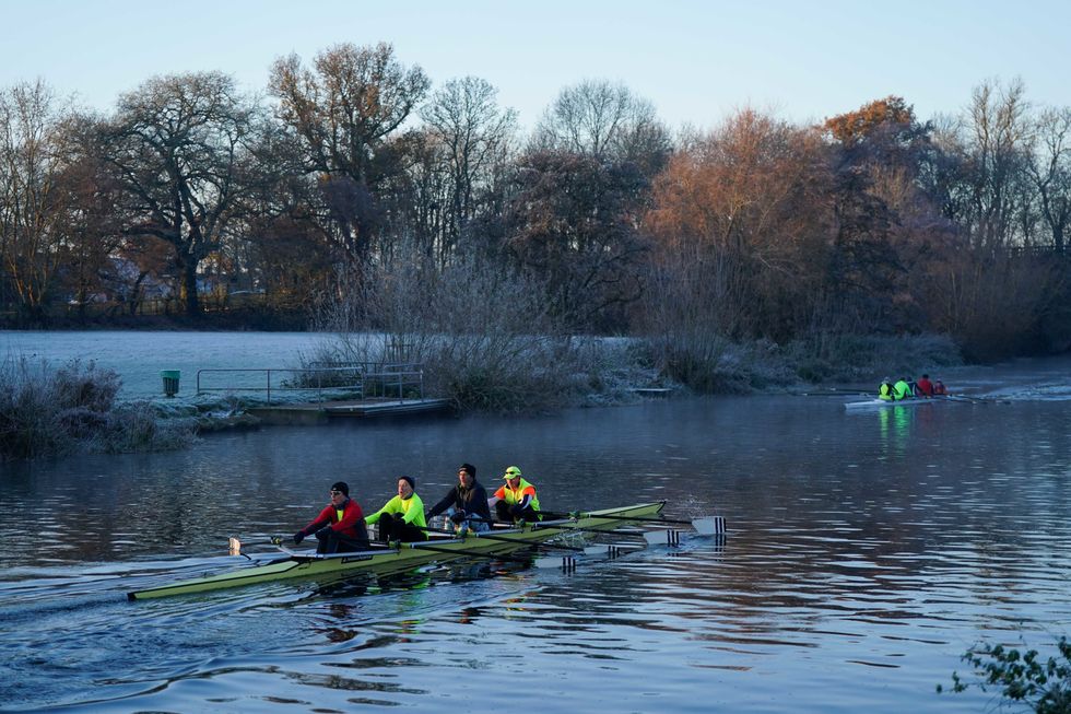 Rowers on the river Avon during a cold sunrise in Warwick. Parts of the UK are being hit by freezing conditions with the UK Health Security Agency (UKHSA) issuing a Level 3 cold weather alert covering England until Monday and the Met Office issuing several yellow weather warnings for snow and ice in parts of the UK over the coming days. Picture date: Saturday December 10, 2022.