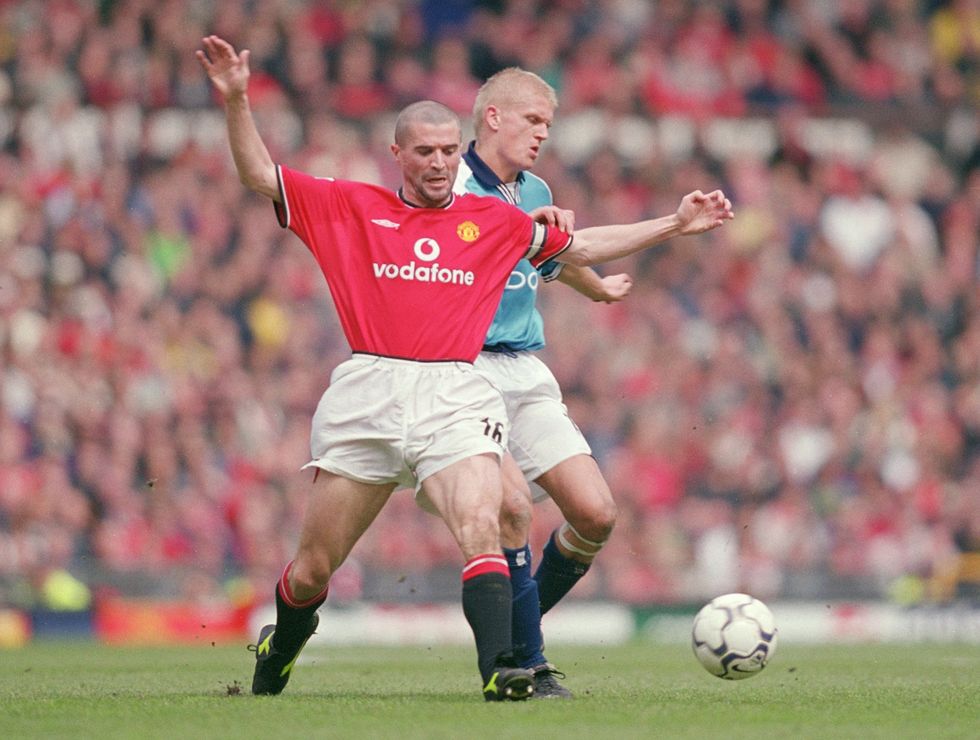 Roy Keane and Alf-Inge Haaland pictured playing in the 2001 Manchester derby at Old Trafford
