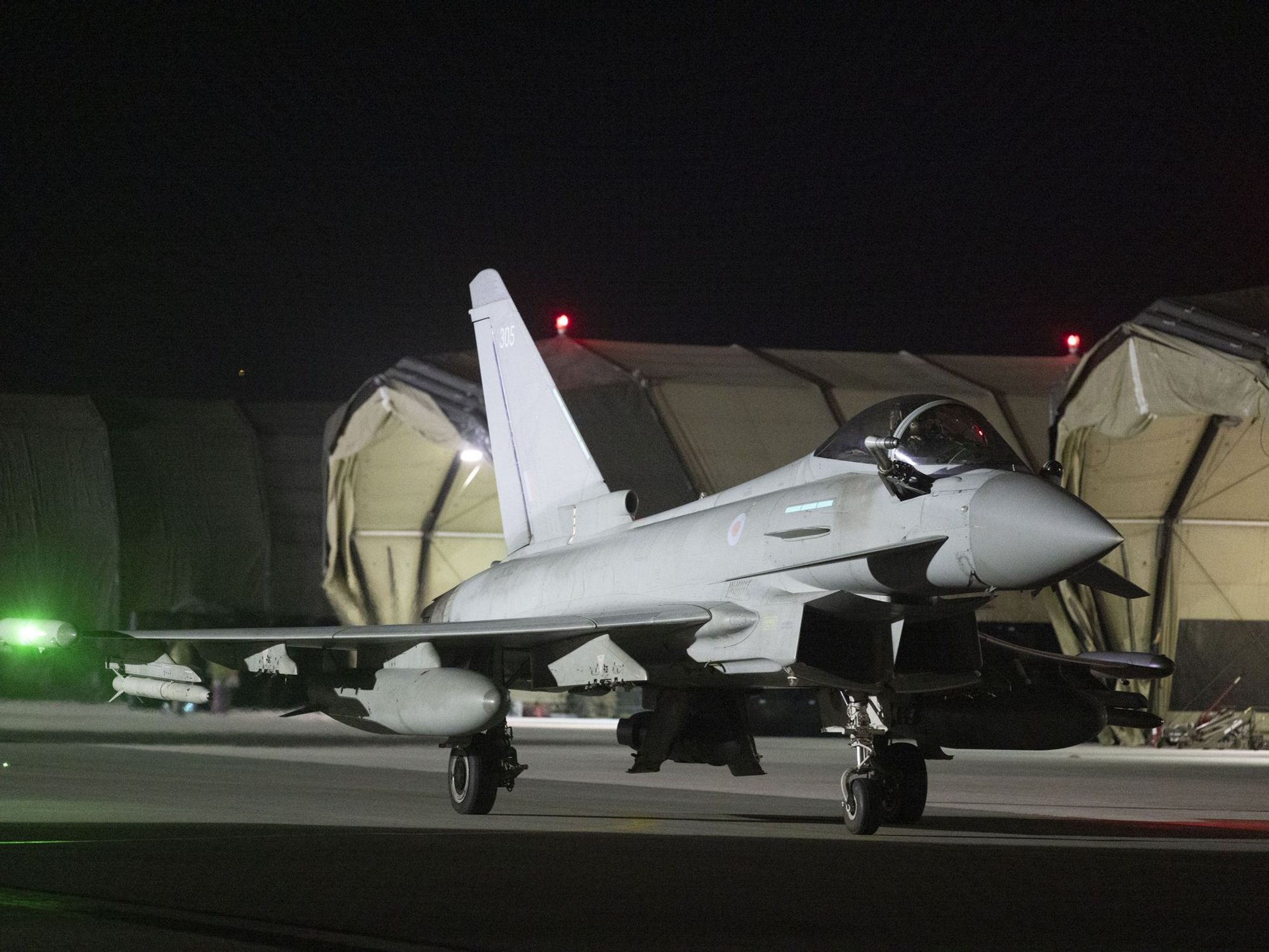 Royal Air Force Typhoon aircraft return to their base in the Middle East.