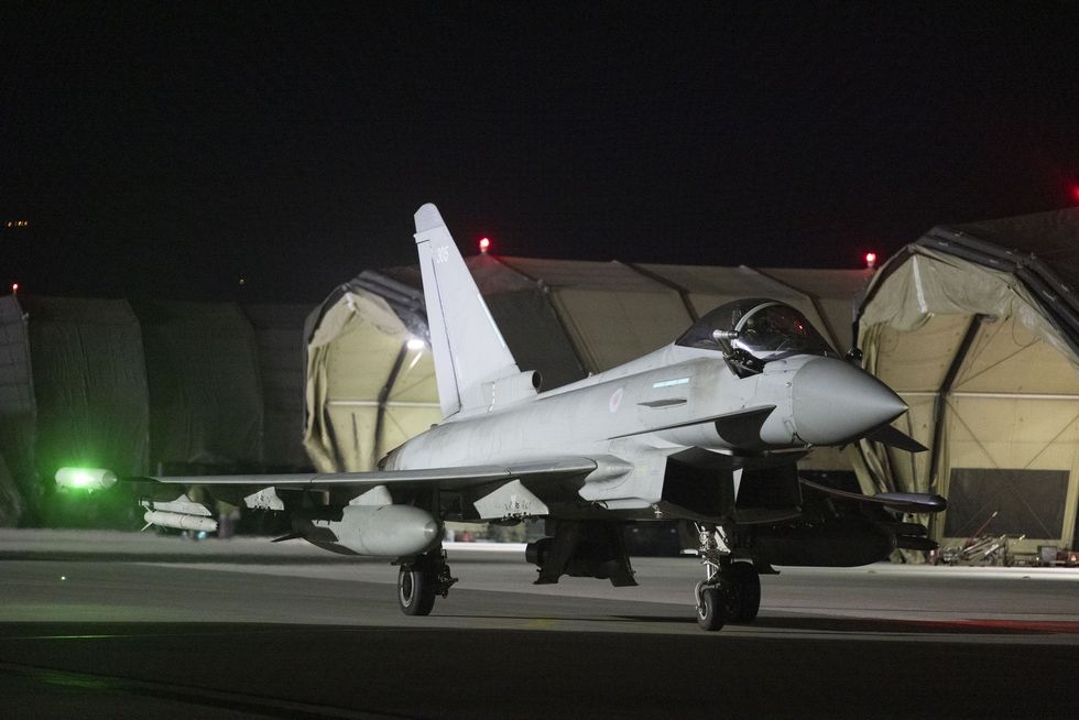 Royal Air Force Typhoon aircraft return to their base in the Middle East.