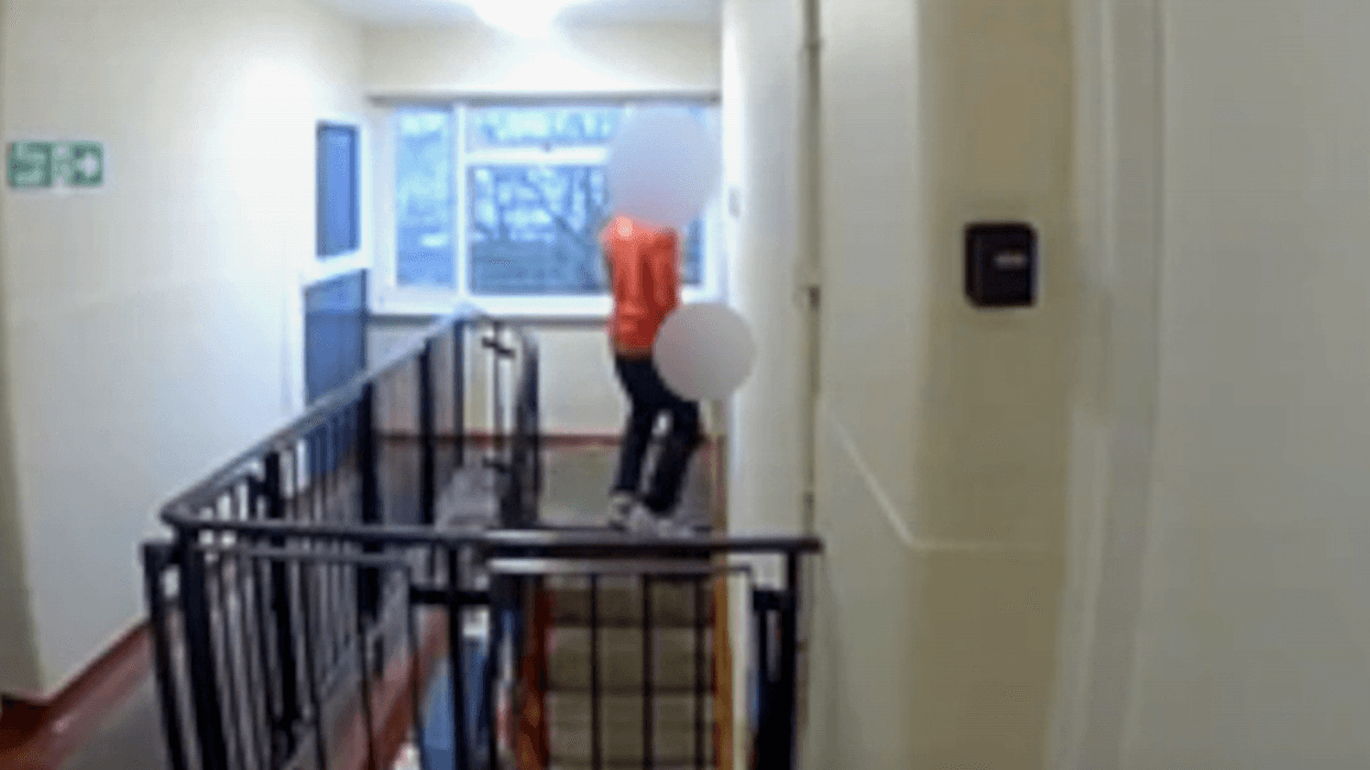 Royal Mail worker urinating in doorway