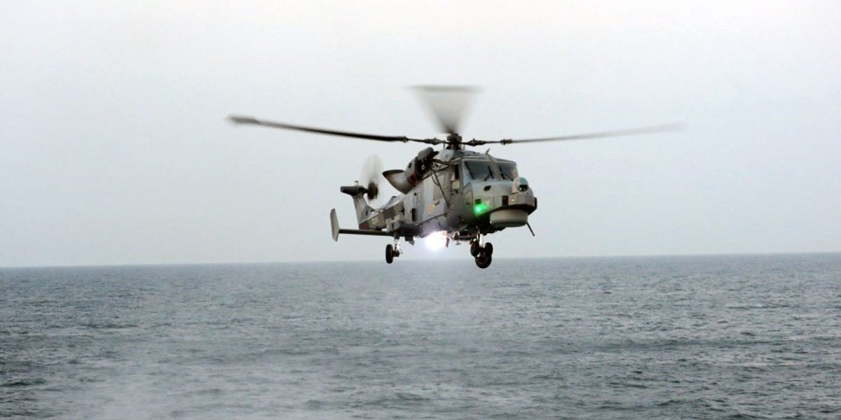 NextImg:Royal Marine sniper takes out drug smuggling gang boat engine with single shot while flying BACKWARDS in helicopter