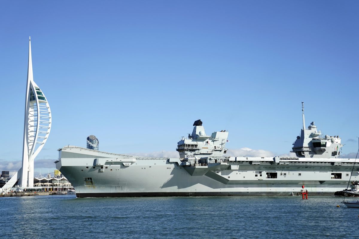 Royal Navy Aircraft carrier HMS Queen Elizabeth arrives back into Portsmouth harbour after a visit to the United States
