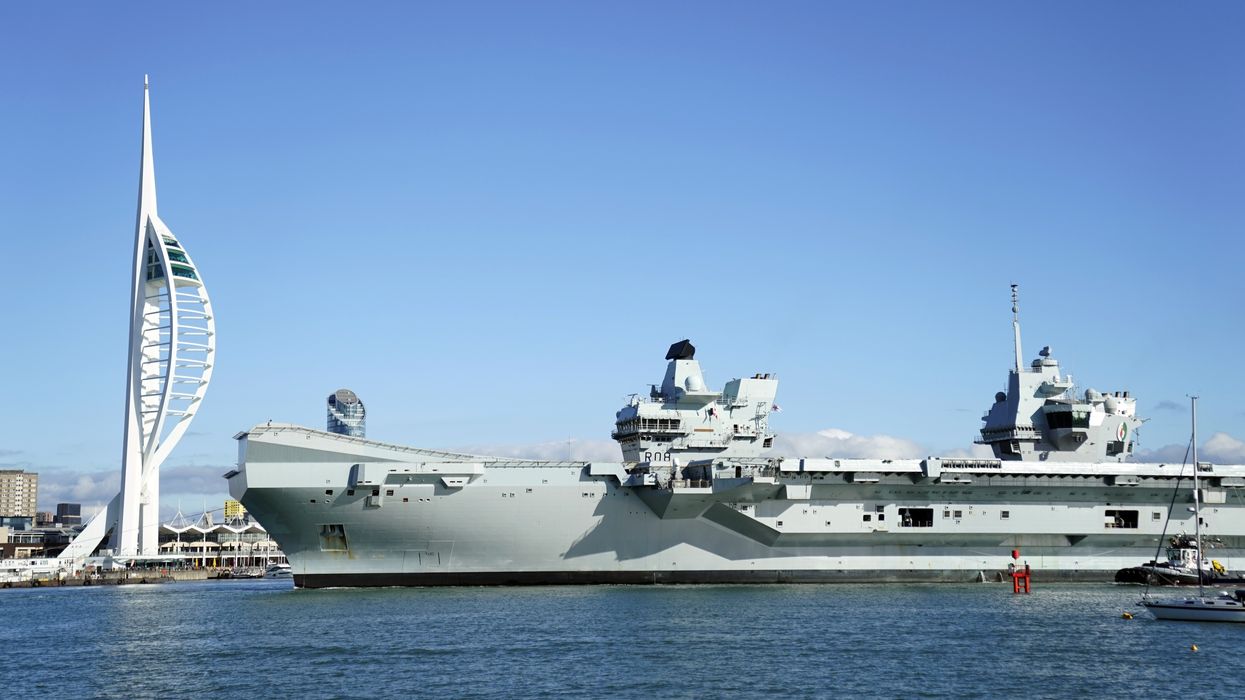 Royal Navy Aircraft carrier HMS Queen Elizabeth arrives back into Portsmouth harbour after a visit to the United States