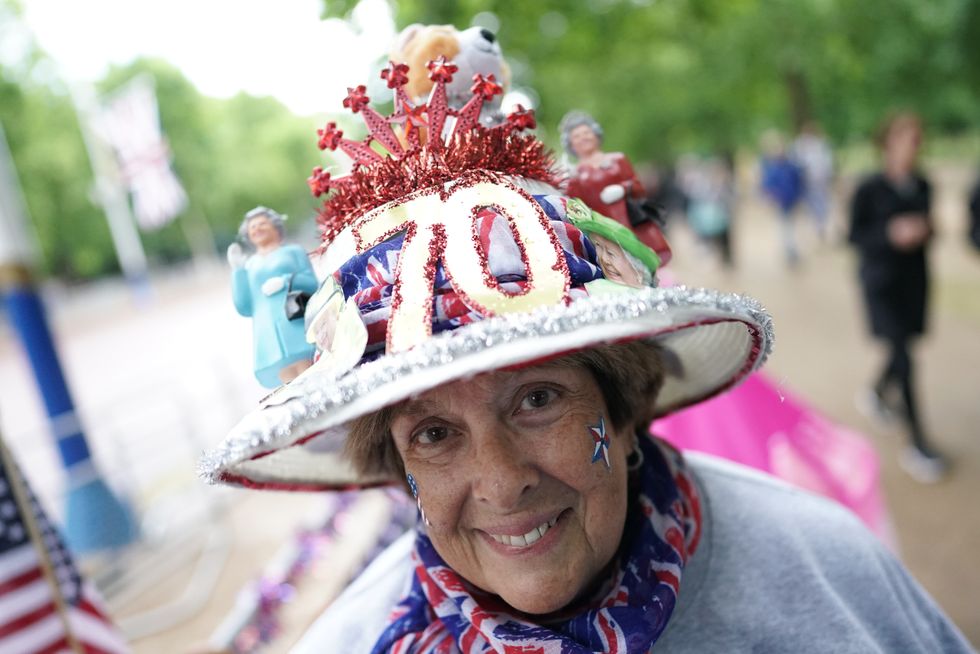 Royal superfan Donna Werner, from the US, on shows off her Jubilee themed straw hat on The Mall, near Buckingham Palace, London, where people are camped out for a prime position to view the Platinum Jubilee celebrations. Picture date: Tuesday May 31, 2022.